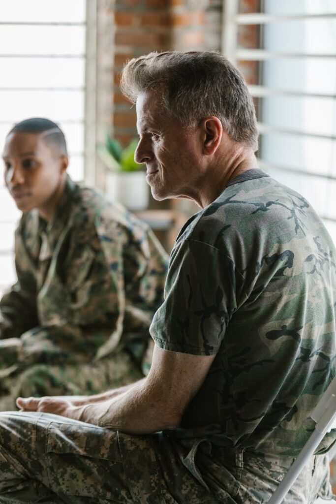 Veterans discussing during a daylight therapy session emphasizing communication and mental health.